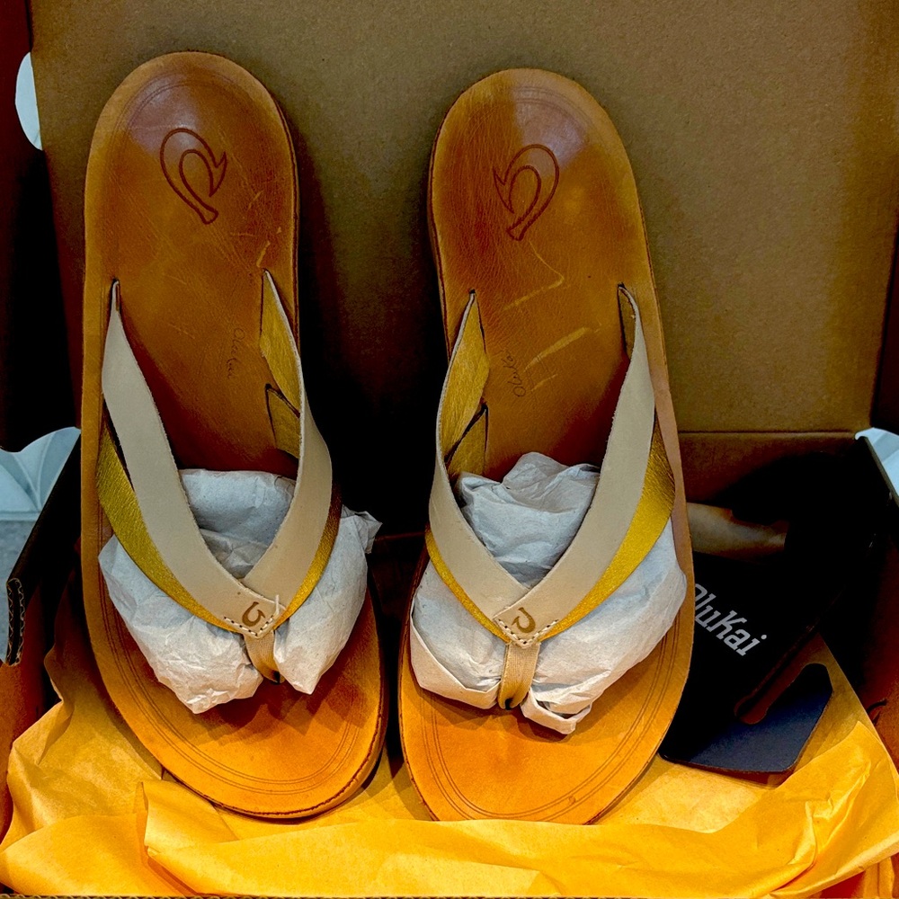 OluKai Women's Brown and Tan Sandals. Gold and ivory strap.  Size 8